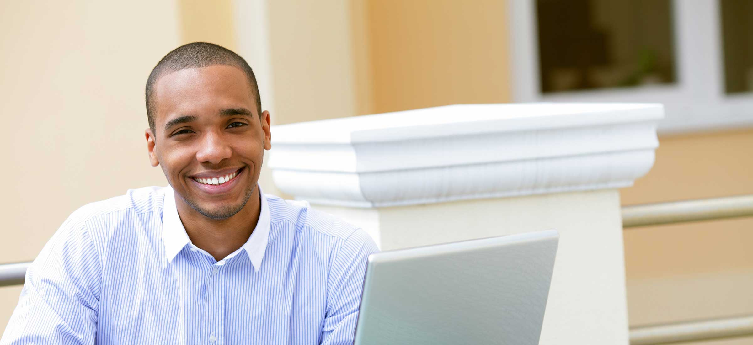 Business student in front of laptop