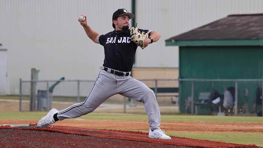 baseball pitcher throwing out pitch to batter