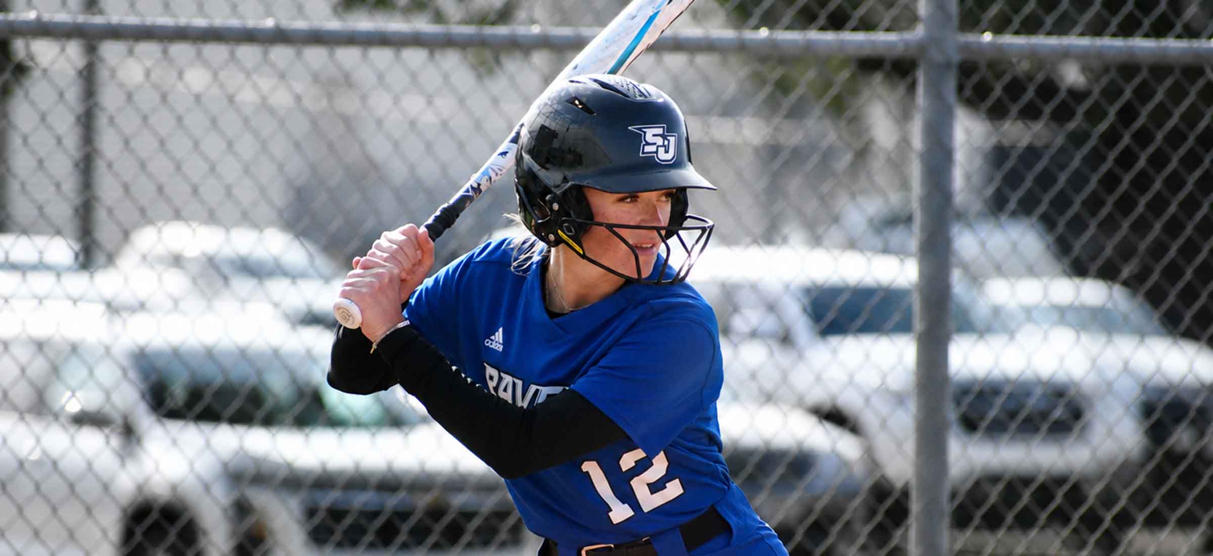 softball batter hitting ball