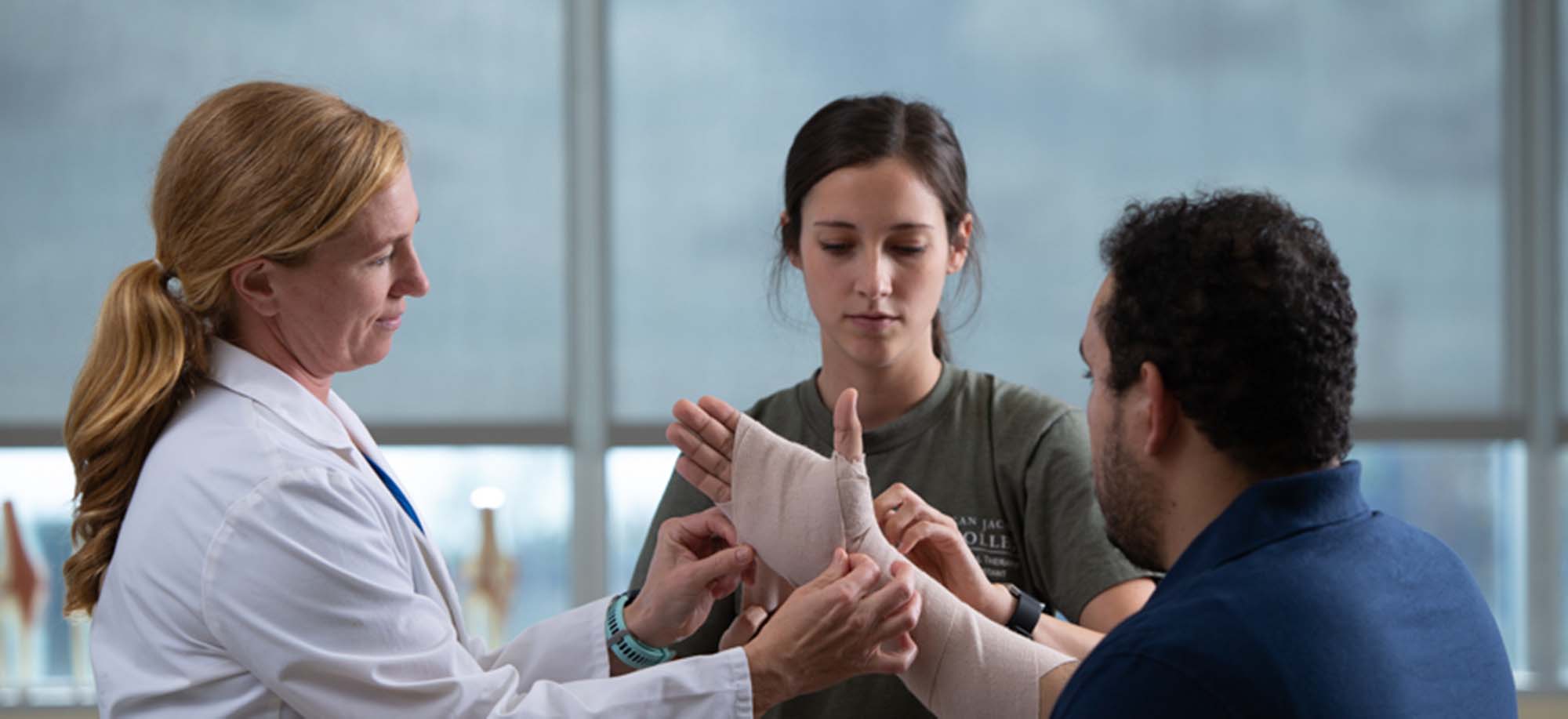 Physical Therapist Assistant helps patient
