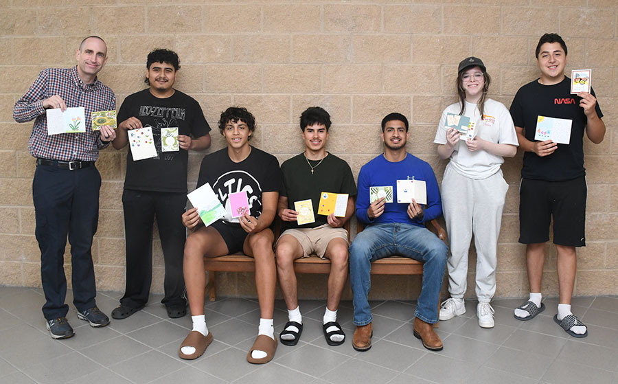 Dr. Bryan Corbin and students create cards for seniors.